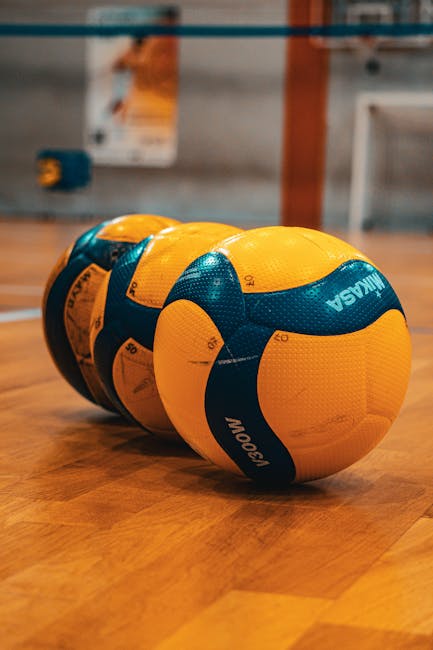 Volleyballs on an indoor sports court