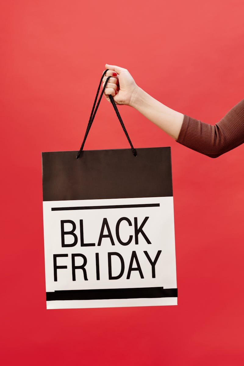 Black Friday shopping bag against red background