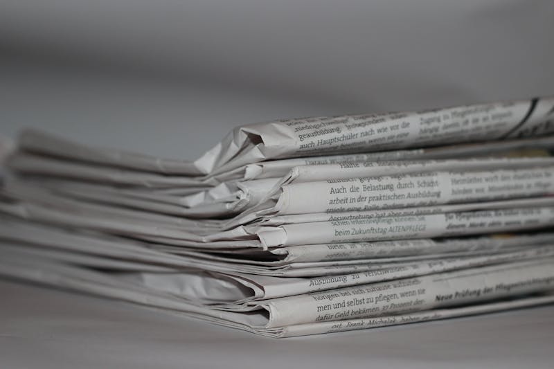 Folded newspapers stacked together