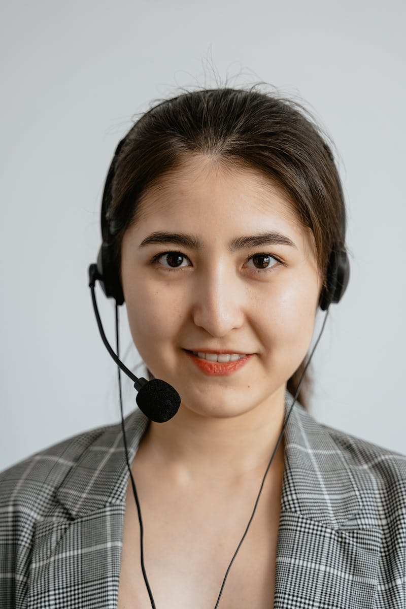 Smiling support agent wearing headset